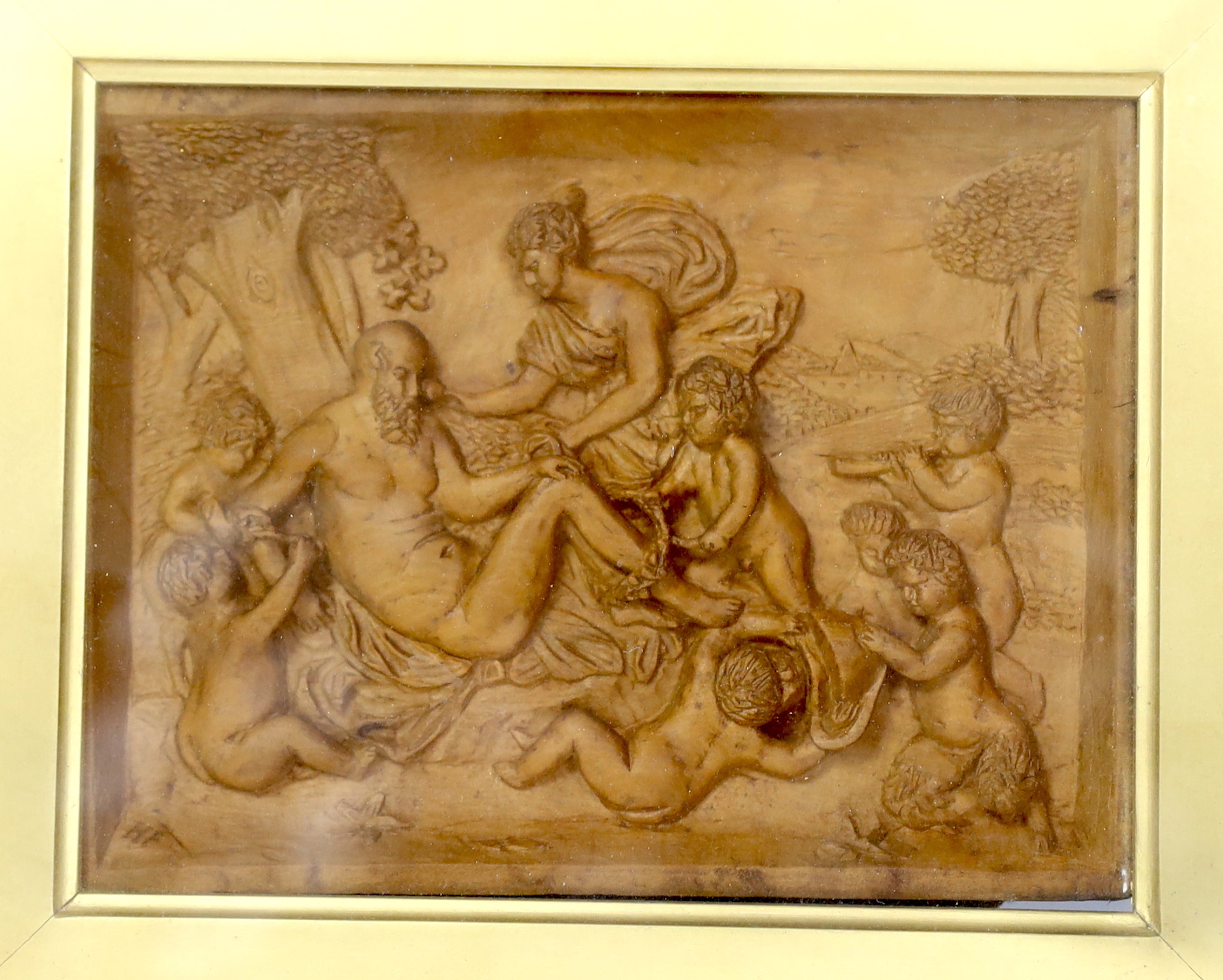 A 19th century framed carved wood panel depicting Bacchanalians, 12x16cm